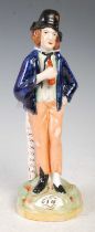 A 19th century Staffordshire pottery double-sided figure of a man titled 'GIN' and 'WATER', 21cm