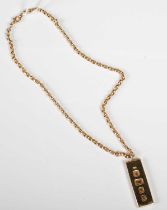 A 9ct gold necklace suspending a 9ct gold ingot shaped pendant, gross weight 40.7 grams.