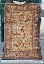 A 20th century Persian silk rug, the rectangular field decorated with processions of warriors and