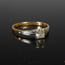 A yellow and white metal solitaire diamond ring, stamped '18ct, plat' size S, gross weight 2.5