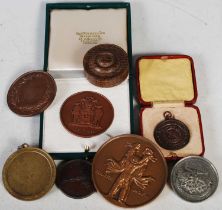 A white metal commemorative medallion cast from 'the lead melted off the roof of Selby Abbey by