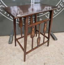 An Art Nouveau mahogany side table, the tapering slatted sides decorated with entwined Celtic knot