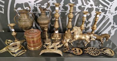 A collection of assorted brassware to include a pair of brass ejector candlesticks, two other