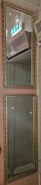 A pair of gilt framed rectangular bevelled wall mirrors, 98cm x 45cm.