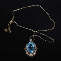 A 9ct gold and topaz set pendant suspended on a 9ct gold chain, gross weight 9.5 grams.