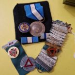 A collection of medals to include a UN Peace Keepers medal on blue and white ribbon, the reverse