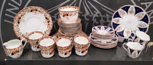 A Meir China part tea set, decorated with pink, blue and gilt with floral details, painted marks