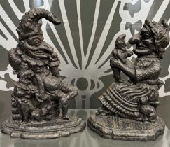 Two antique cast iron doorstops in the form of Punch and Judy, Punch 30.5cm high, Judy 29cm high.