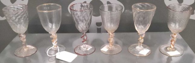A set of six clear and coloured sherry glasses, late 19th/ early 20th century, three with wrythen