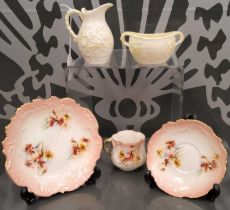 A Nautilus porcelain trio, decorated with red and yellow poppies comprising cup, saucer and side