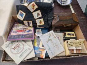 A box of mixed wares to include various cigarette cards albums, fabric cigarette cards stitched to a