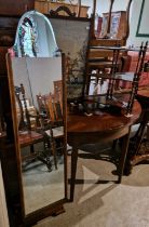 A group of furniture comprising a pair of 20th century mahogany three-tier serpentine form hanging