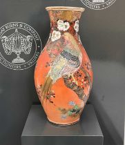 A Japanese Satsuma pottery vase, the burnt umber ground decorated with birds and mixed foliage, 46.