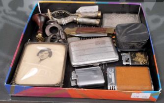 A collection of various to include assorted lighters, cigarette cases, nut crack, wood and brass wax