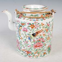 A Chinese porcelain famille rose canton tea kettle and cover, Qing Dynasty, with double hinged