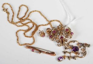 A 9ct gold, split pearl and ruby set Art Nouveau pendant suspended on a 9ct gold chain, gross weight