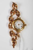 An early 20th century ladies 18ct gold cased wristwatch with black, white and red Roman numeral