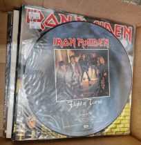 A group of sixteen period heavy metal LP's comprising seven by Iron Maiden: a picture press of '