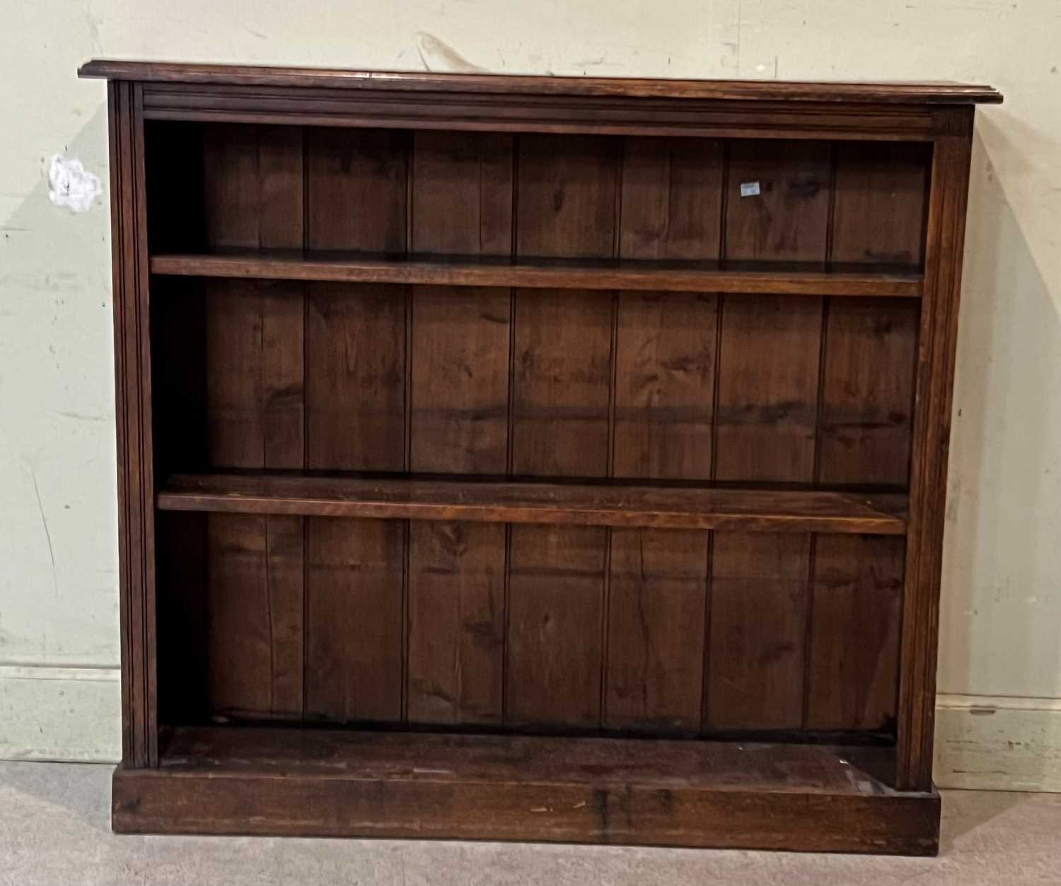 A late 19th century oak open bookcase with two shelves, 107cm high x 120.5cm wide x 30cm deep.