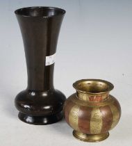 An early 20th century bronze vase of tapered cylindrical form, 18.5cm high, together with a small