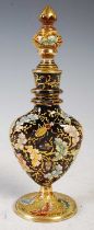 A late 19th/ early 20th century ruby glass perfume bottle and stopper attributed to 'Moser', with