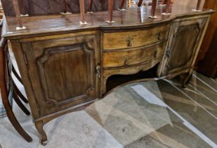 A late 19th century stained wood bowfront sideboard, centred with a single short drawer above