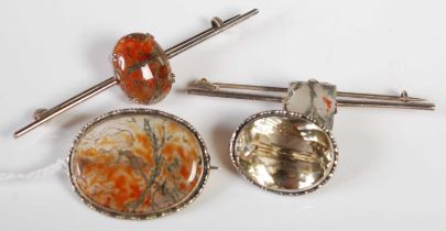 A white metal mounted oval shaped moss agate brooch, together with two other moss agate mounted