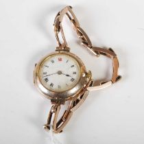 A vintage 9ct gold case ladies wristwatch with white, black and red Roman numeral dial, expandable