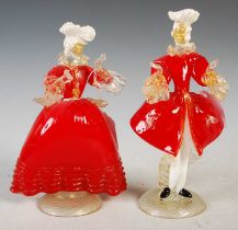 A pair of clear, gilt, opaque white and red glass figures modelled as 18th century male, 21cm