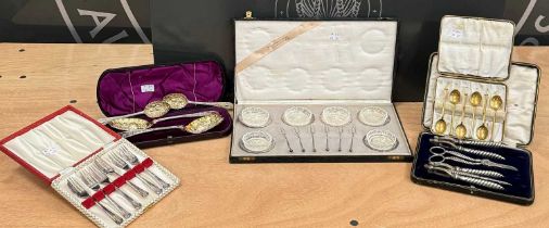 A collection of cased EPNS ware to include a cased set of six cake forks; a cased set of six gilt-