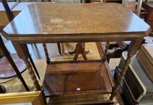 An early 20th century oak side table with barley twist supports, raised on four shaped feet.