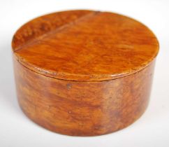 A Mauchline ware circular snuff box in richly grained wood with three-quarter opening integral