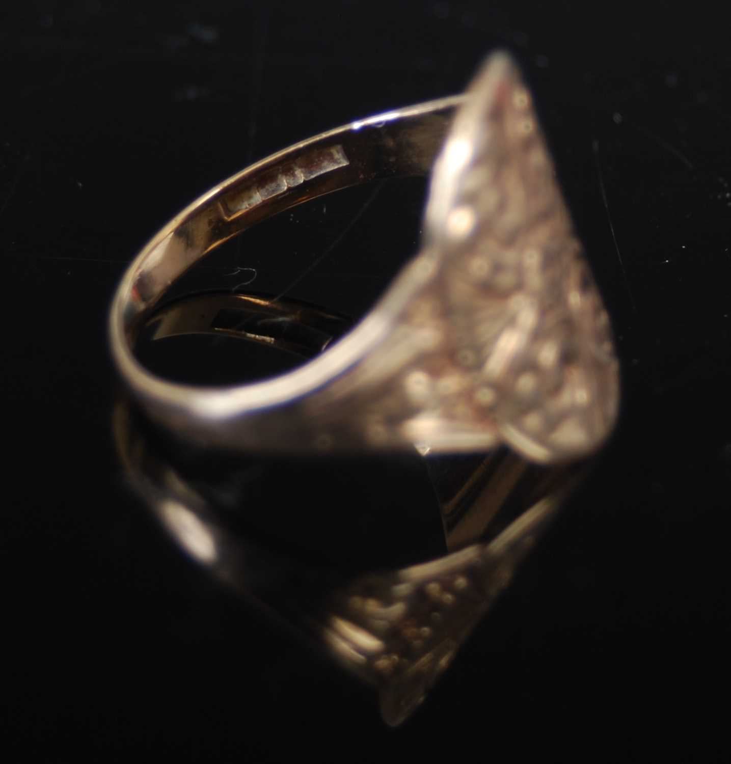 A group of three rings, to include a 9ct gold dress ring, size 'N' and two other 9ct gold and gem - Image 5 of 5