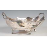 A George V silver twin-handled bowl, Sheffield, 1927, makers mark of H.A, oval-shaped with wavy rim,