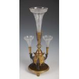 A late 19th century silver plated and gilt metal camel epergne, centred with a wheel-cut glass