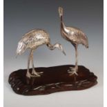 A late 19th / early 20th century Japanese white metal figure group of two Manchurian Cranes, mounted