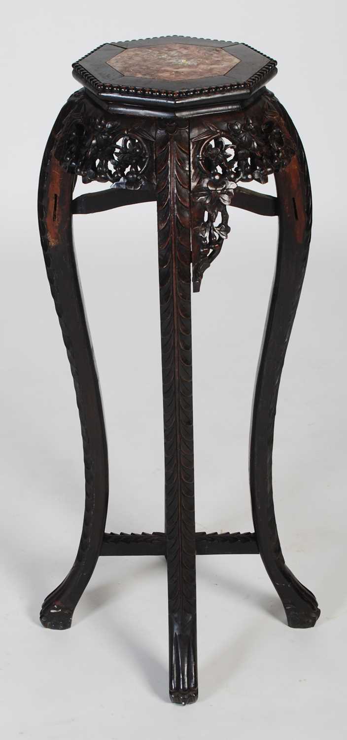 A Chinese dark wood urn stand, late 19th/ early 20th century, the octagonal-shaped top centred - Image 7 of 7