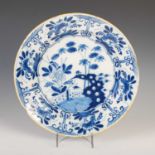 A late 18th / early 19th century blue and white Delft pottery charger, decorated in the Chinese