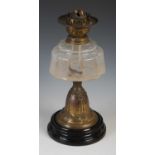 A late 19th century brass and clear glass paraffin burning oil lamp, 38cm high.