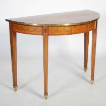 A 19th century walnut, marquetry and gilt metal mounted demi-lune console table, the inlaid top