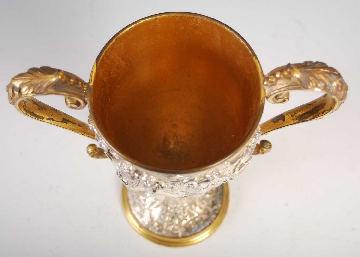 A Victorian silver-plated and gilt metal twin-handled cup, decorated in high relief with a frieze of - Image 6 of 7