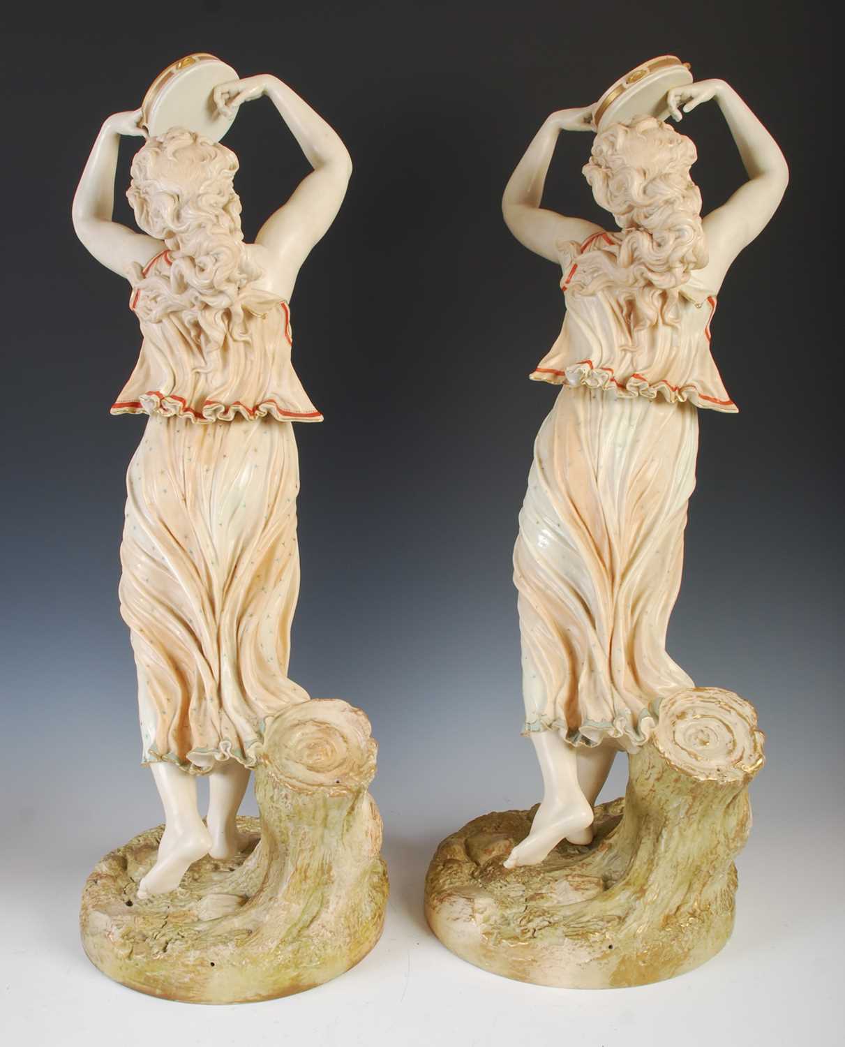 A large pair of Royal Worcester female tambourine players, modelled by James Hadley, with red, green - Image 6 of 8