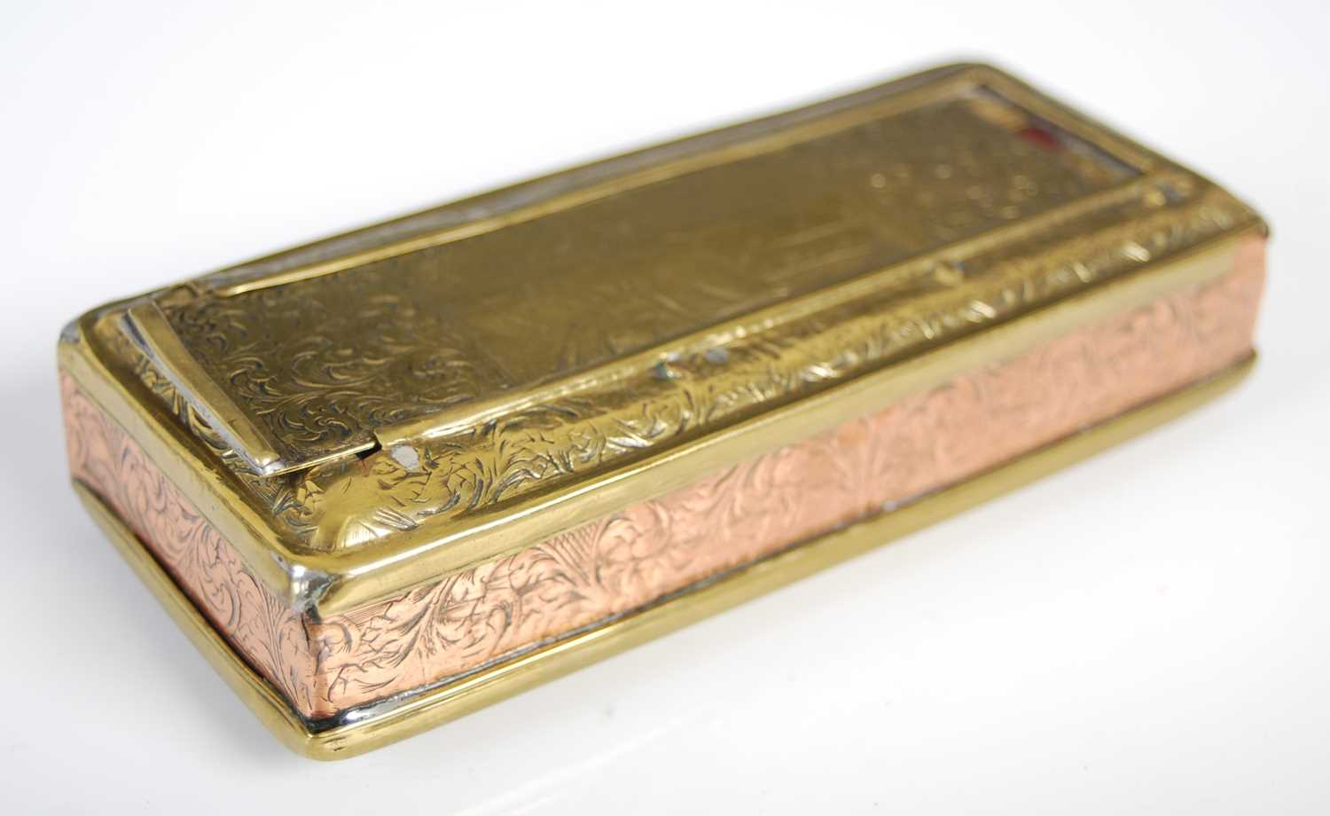 A Fine Dutch brass and copper oblong tobacco box, the hinged cover and base with sliding panels