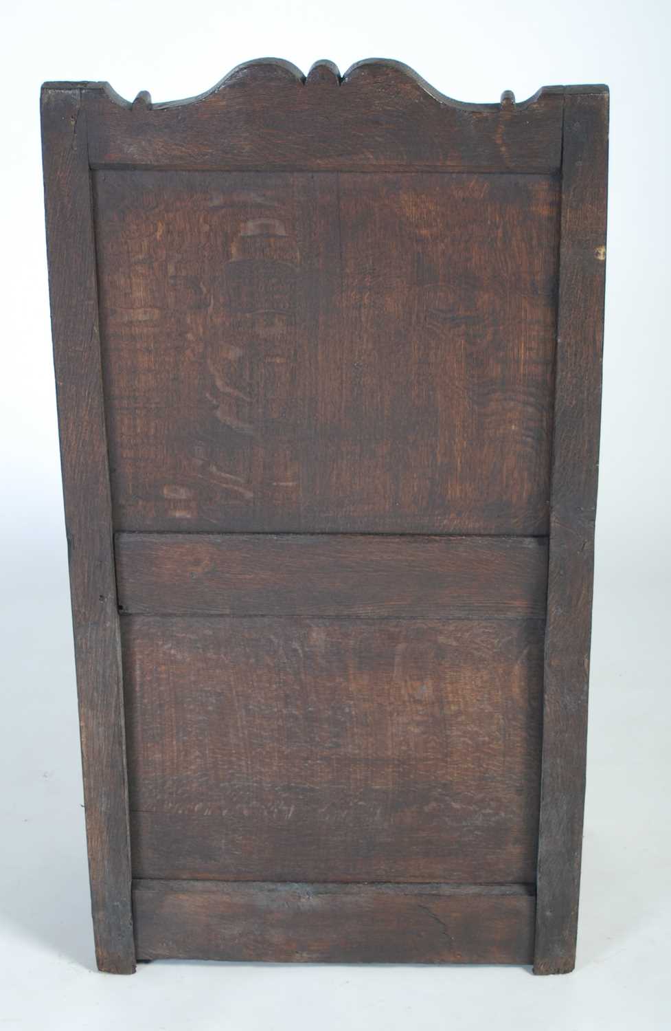 An 18th century oak lambing chair, the shaped top rail above a rectangular panelled back, the box - Image 6 of 6