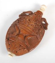 A late 18th / early 19th century French carved coquilla nut scent bottle, carved on both sides