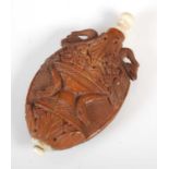 A late 18th / early 19th century French carved coquilla nut scent bottle, carved on both sides