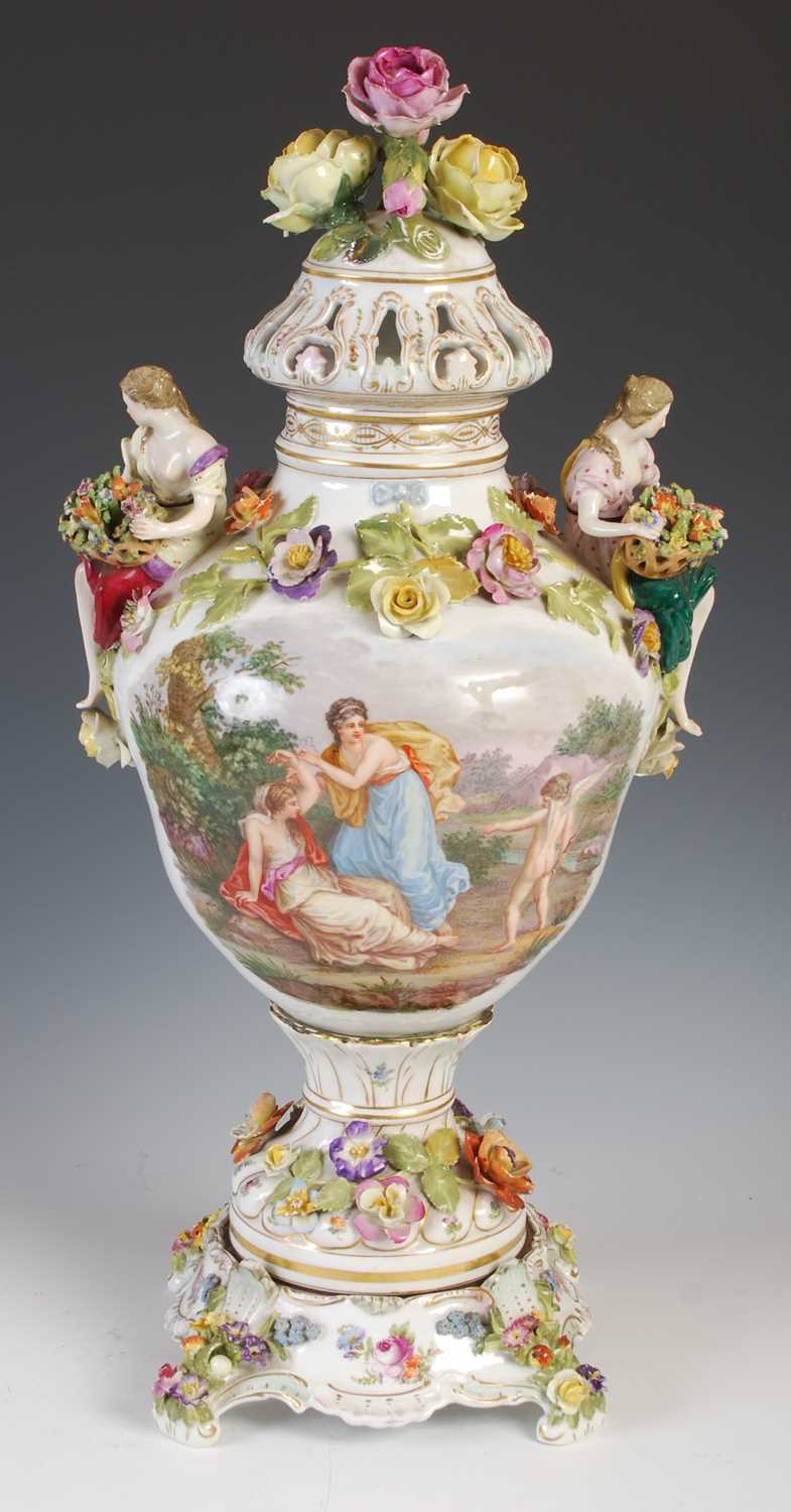 A late 19th / early 20th century Dresden porcelain urn, cover and stand, the urn decorated with