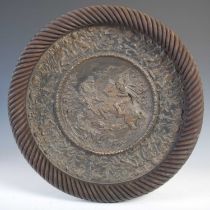 Wilhelm Schiller & Sons, a Renaissance style pottery charger with bronzed finish, mounted within