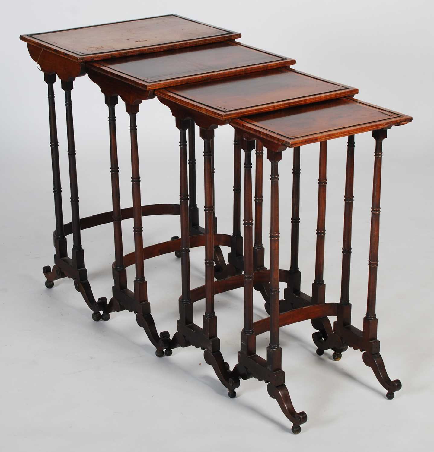 A 19th century quartetto of mahogany, ebony and brass lined occasional tables, the rectangular
