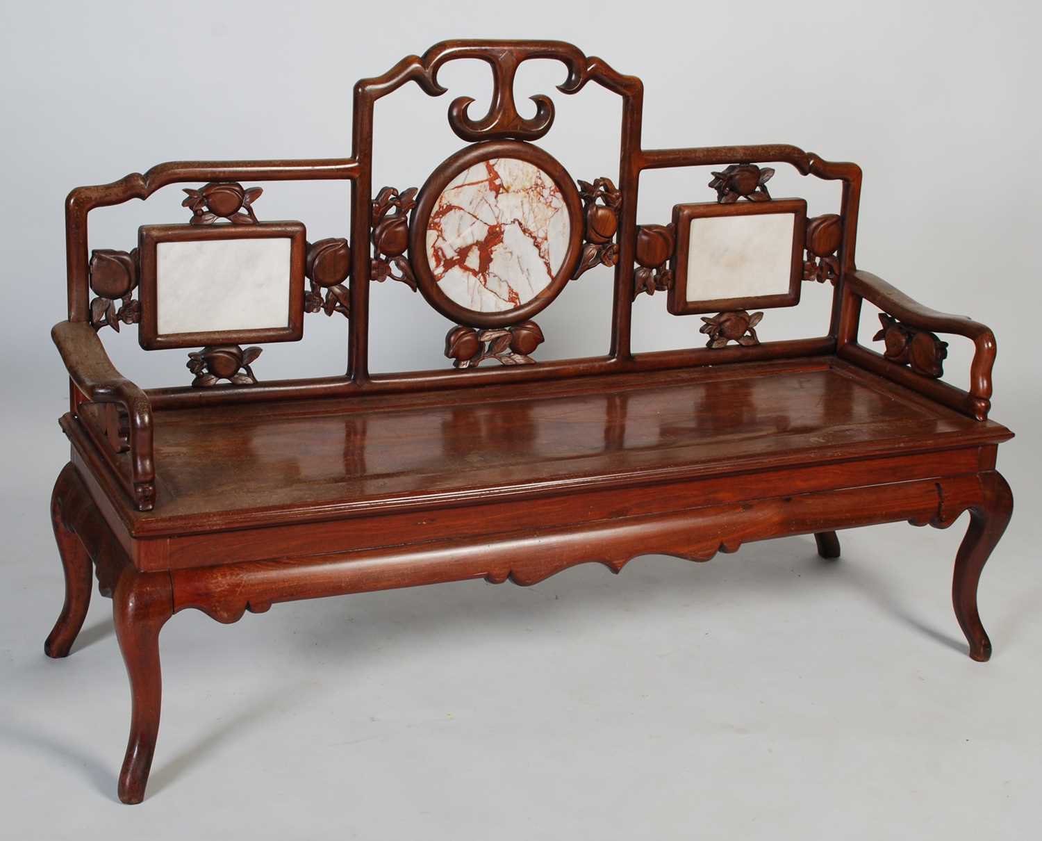 A Chinese dark wood and marble bench, late 19th/ early 20th century, the upright back centred with a